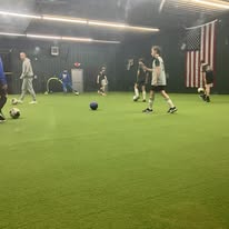 Kids doing soccer and agility drills on the indoor turf